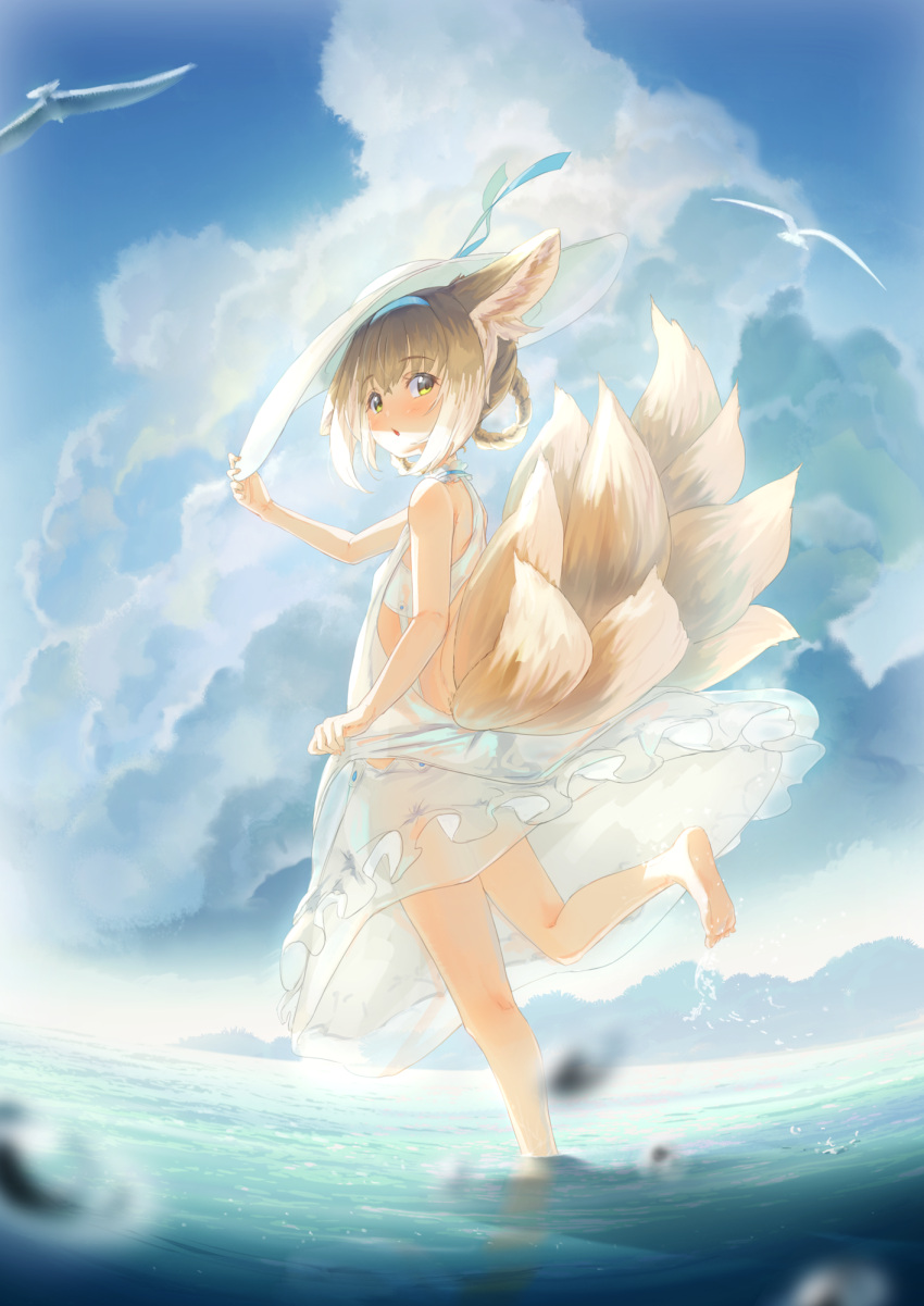 1girl animal animal_ears arknights backless_dress backless_outfit bangs bare_arms bare_shoulders barefoot bird blonde_hair blue_hairband blue_sky blurry blurry_foreground blush braid brown_hair clouds cloudy_sky commentary_request day depth_of_field dress eyebrows_visible_through_hair feet fox_ears fox_girl fox_tail hair_between_eyes hair_rings hairband hand_on_headwear hand_up hat highres kyuubi looking_at_viewer looking_to_the_side multicolored_hair multiple_tails outdoors parted_lips see-through sky soles solo standing standing_on_one_leg sun_hat suzuran_(arknights) tail twin_braids two-tone_hair water water_drop white_dress white_hair white_headwear widea7