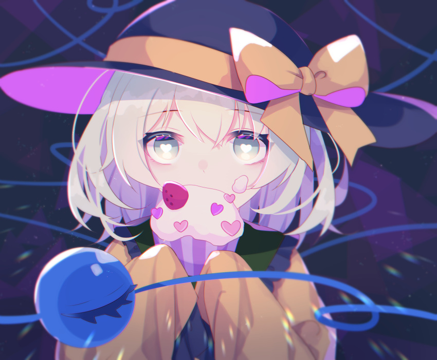 1girl black_headwear blouse bow bright_pupils commentary covered_mouth cupcake food food_on_face frilled_shirt_collar frilled_sleeves frills fruit green_eyes hair_between_eyes hands_up hat hat_bow heart heart-shaped_pupils highres holding holding_food komeiji_koishi light_green_hair long_sleeves medium_hair shinketsu_kanyu sleeves_past_fingers sleeves_past_wrists solo strawberry symbol-shaped_pupils third_eye touhou upper_body white_pupils wide_sleeves yellow_blouse yellow_bow