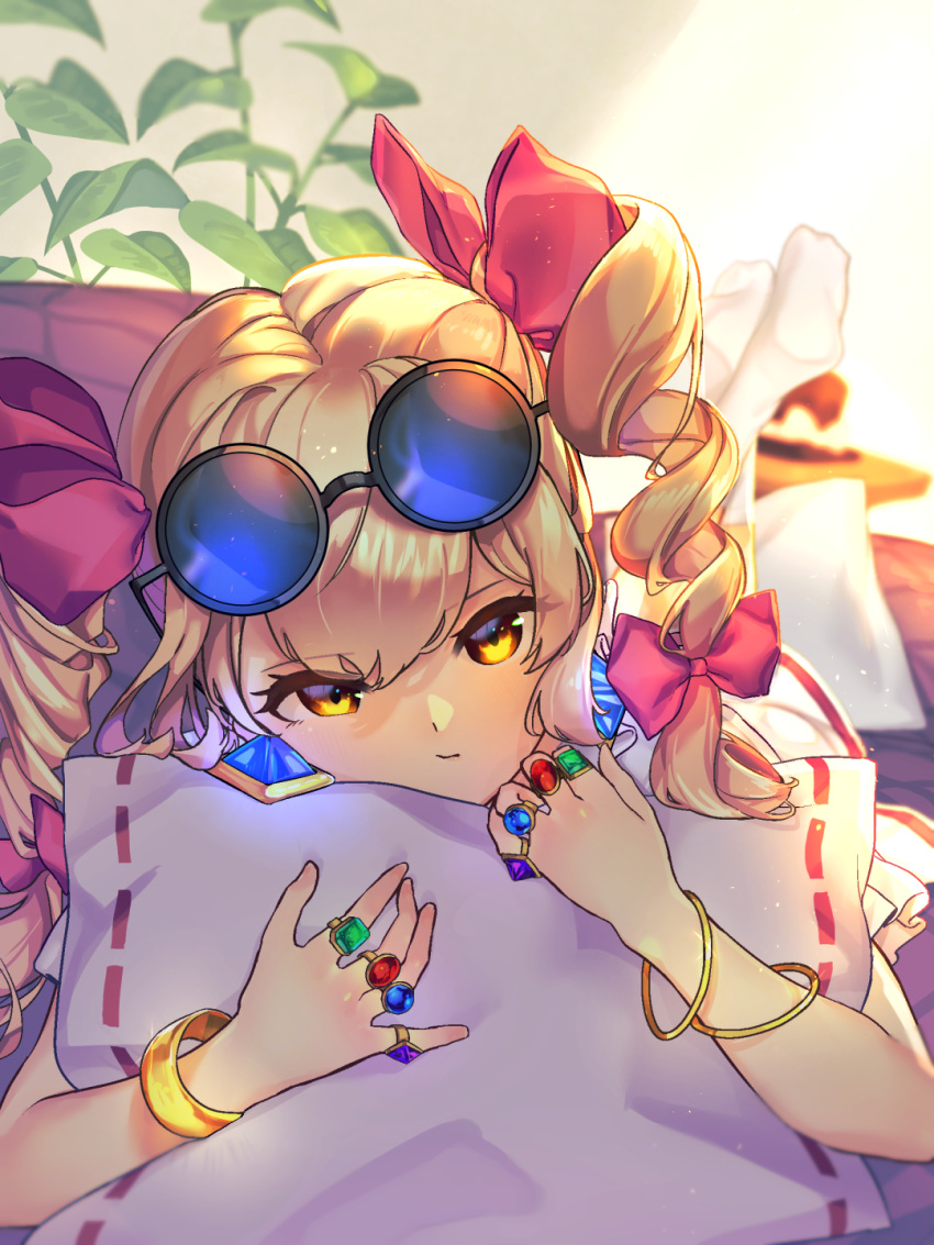 1girl bangle bangs blonde_hair bracelet closed_mouth commentary_request couch drill_hair earrings eyewear_on_head hair_ribbon hat highres jewelry lips lying mini_hat on_stomach orange_eyes pillow plant red_ribbon ribbon ribbon_trim ring round_eyewear solo top_hat touhou tress_ribbon wankosoba yorigami_jo'on