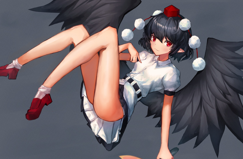 1girl ass bangs bird_wings black_hair black_skirt black_wings blush breasts closed_mouth eyebrows_behind_hair feathered_wings full_body grey_background hair_between_eyes hand_fan hat hauchiwa highres holding holding_fan leste_(humansequencer) looking_at_viewer no_panties petticoat pleated_skirt pointy_ears pom_pom_(clothes) puffy_short_sleeves puffy_sleeves red_eyes red_footwear red_headwear shameimaru_aya shirt short_hair short_sleeves simple_background skirt small_breasts smile solo tokin_hat touhou white_shirt wings