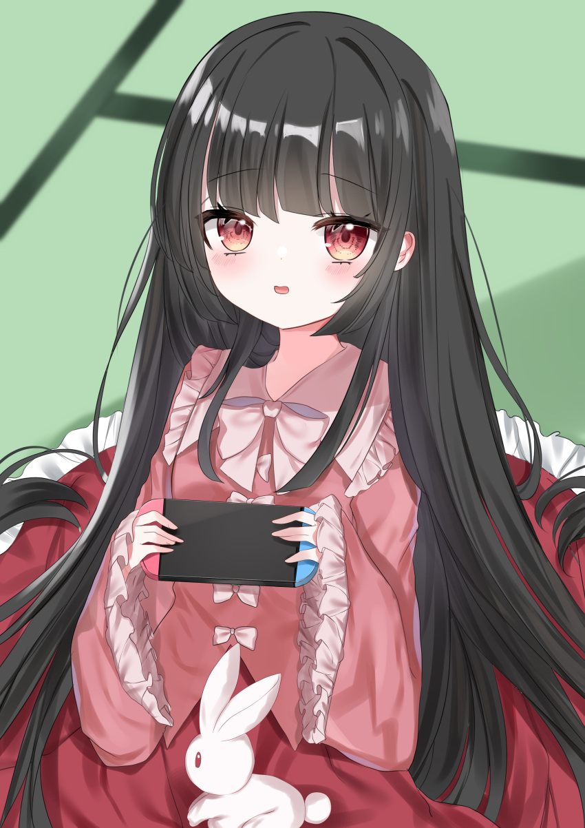 1girl absurdres bangs black_hair blunt_bangs blurry blurry_background bow bowtie collarbone controller dress dress_bow eyebrows_visible_through_hair game_controller highres hime_cut holding holding_controller holding_game_controller houraisan_kaguya long_hair long_sleeves looking_at_viewer multiple_bows nintendo_switch okome2028 open_mouth pink_dress rabbit red_eyes red_skirt sitting skirt solo touhou very_long_hair white_bow white_bowtie wide_sleeves