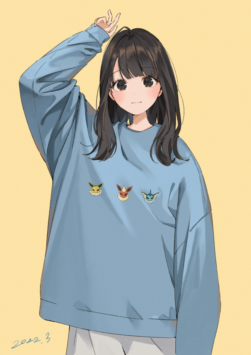 1girl absurdres ahoge arm_up bangs blue_sweater blush brown_eyes character_print closed_mouth commentary_request dated flareon highres jolteon long_hair long_sleeves looking_at_viewer original pokemon print_sweater sako_(35s_00) shiny shiny_hair simple_background sleeves_past_wrists smile solo sweater vaporeon yellow_background