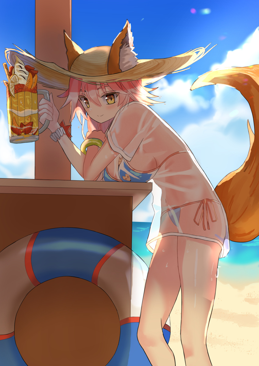 1girl absurdres animal_ear_fluff animal_ears bangs beach bikini blue_bikini blush bracelet breast_rest breasts closed_mouth commentary cup day eyebrows_behind_hair fate/grand_order fate_(series) feet_out_of_frame food fox_ears fox_girl fox_tail hat highres holding holding_cup iro_(boo_iro) jewelry large_breasts looking_at_viewer mug navel outdoors parfait pink_hair see-through shadow shirt short_sleeves side-tie_bikini sidelocks smile solo standing string_bikini sun_hat sweat swimsuit tail tamamo_(fate) tamamo_no_mae_(swimsuit_lancer)_(fate) wet wet_clothes wet_shirt yellow_eyes