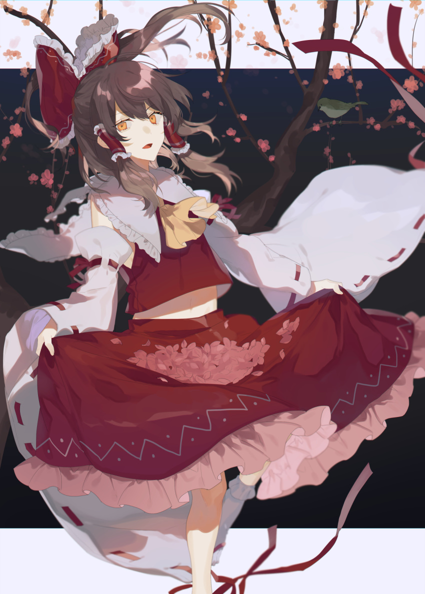 1girl :d ascot bird bow branch brown_hair cherry_blossoms commentary detached_sleeves eyebrows_visible_through_hair floating_hair foot_out_of_frame frilled_bow frilled_hair_tubes frilled_shirt_collar frilled_skirt frills hair_bow hair_tubes hakurei_reimu highres long_hair long_sleeves looking_at_viewer midriff open_mouth petals ponytail red_bow red_skirt red_vest ribbon-trimmed_sleeves ribbon_trim shuukenyuu sidelocks skirt skirt_basket skirt_hold skirt_set smile socks solo standing standing_on_one_leg touhou tsurime vest white_legwear white_sleeves wide_sleeves yellow_ascot yellow_eyes
