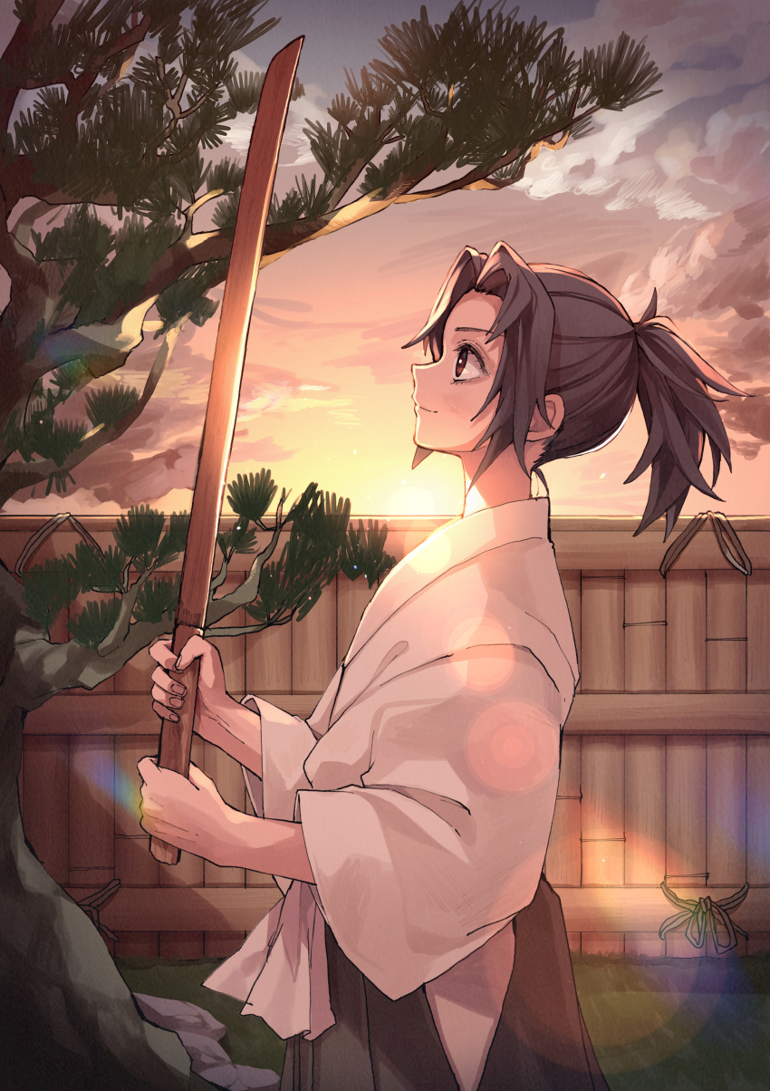 1boy absurdres black_hair bokken bruise bruise_on_face child clouds cowboy_shot day fence from_side hakama highres holding holding_sword holding_weapon injury japanese_clothes kimetsu_no_yaiba long_sleeves male_focus outdoors ponytail profile red_eyes sky smile solo sun sword tree tsugikuni_michikatsu weapon wide_sleeves wooden_sword yogukasu younger