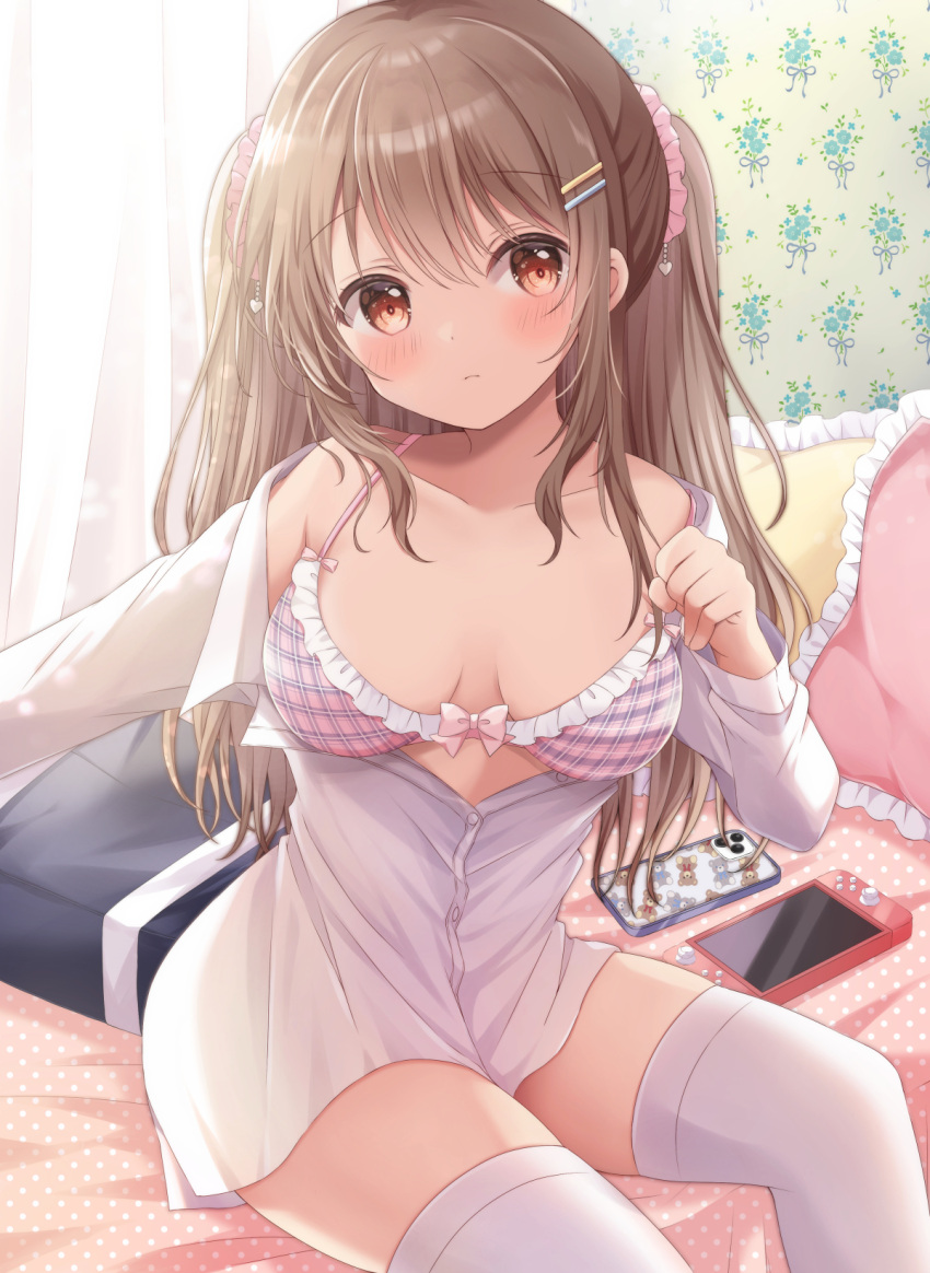 1girl bag bangs bed bra breasts brown_eyes brown_hair cellphone closed_mouth collarbone commentary_request curtains dress_shirt eyebrows_visible_through_hair frilled_bra frilled_pillow frills hair_between_eyes hair_ornament hair_scrunchie hairclip highres indoors long_hair long_sleeves looking_at_viewer nintendo_switch on_bed original phone pillow pink_bra sakura_(ichisakupink) school_bag scrunchie shirt sitting small_breasts smartphone smartphone_case solo thigh-highs twintails underwear white_legwear white_shirt