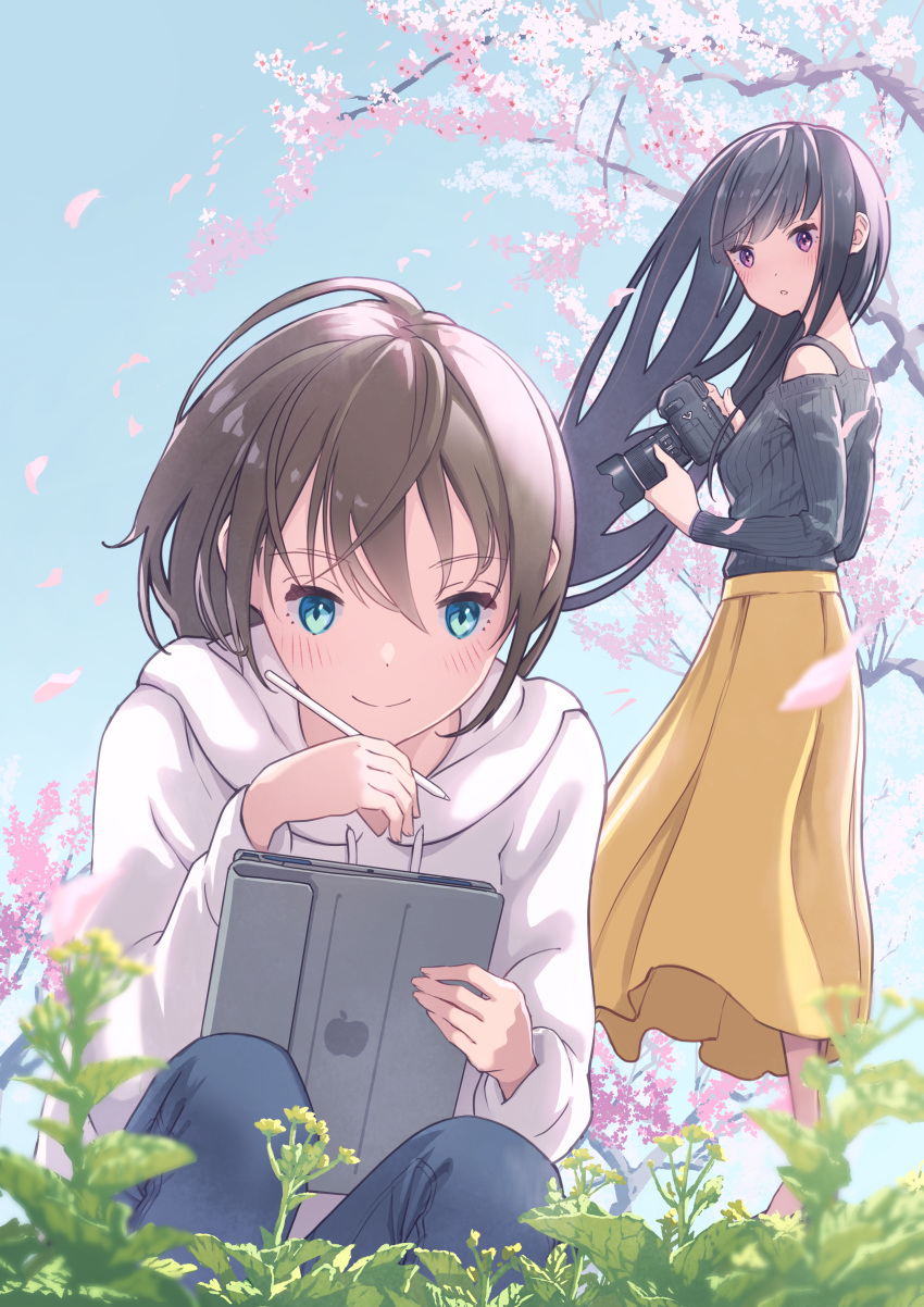 2girls absurdres apple_inc. black_hair black_shirt blue_eyes blue_sky blurry blurry_foreground blush brown_hair camera cherry_blossoms closed_mouth commentary_request day denim drawstring falling_petals flower grass highres holding holding_camera holding_tablet_pc hood hood_down hoodie jeans long_hair long_sleeves looking_at_another michinoku_(hiking_miusan18) multiple_girls original outdoors pants parted_lips petals pink_flower shirt skirt sky smile tablet_pc tree violet_eyes white_hoodie yellow_skirt