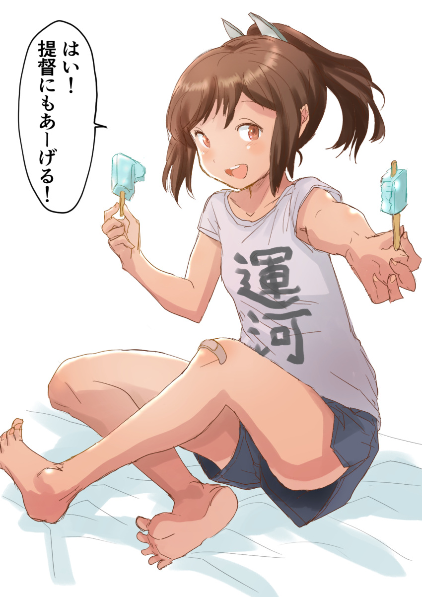 1girl alternate_costume bandaid bandaid_on_knee bandaid_on_leg barefoot bed blue_shorts brown_eyes brown_hair casual commentary_request fuji_(pixiv24804665) full_body grey_shirt highres i-401_(kancolle) indian_style kantai_collection ponytail shirt shitty_t-shirt_naval_base short_hair shorts simple_background sitting solo t-shirt tan tanlines translation_request white_background