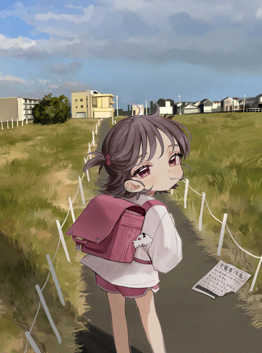 1girl artist_name backpack bag bag_charm bangs brown_hair building candy charm_(object) child closed_mouth clouds cloudy_sky day feet_out_of_frame film_grain flyer food from_behind grass hair_bobbles hair_ornament highres house ishita_umi lollipop long_sleeves looking_at_viewer looking_back original outdoors randoseru red_eyes red_shorts road shirt short_hair shorts sky solo standing translation_request two_side_up watermark white_shirt