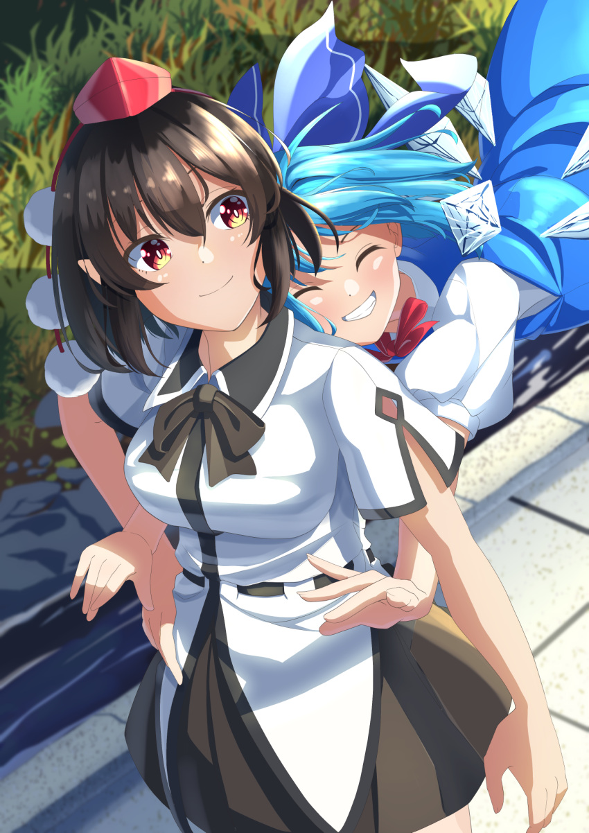 2girls amanoyayuki black_bow black_bowtie black_skirt blue_bow blue_dress blue_hair bow bowtie breasts brown_hair cirno closed_eyes closed_mouth collared_shirt cowboy_shot day detached_sleeves dress grass hair_between_eyes hair_bow happy hat highres hug hug_from_behind ice ice_wings medium_breasts medium_hair multiple_girls outdoors pinafore_dress puffy_short_sleeves puffy_sleeves red_eyes red_headwear shameimaru_aya shiny shiny_hair shirt short_sleeves skirt smile tokin_hat touhou white_shirt wings