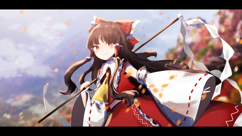 1girl ascot blurry blurry_background bow brown_eyes brown_hair cake_mogo closed_mouth detached_sleeves eyebrows_visible_through_hair frilled_ascot frilled_bow frilled_hair_tubes frilled_shirt_collar frilled_skirt frills gohei hair_bow hair_tubes hakurei_reimu holding holding_stick letterboxed long_hair looking_at_viewer outdoors red_bow red_ribbon red_shirt red_skirt ribbon ribbon-trimmed_sleeves ribbon_trim shirt skirt sleeveless sleeveless_shirt smile solo stick symbol-only_commentary touhou wide_sleeves yellow_ascot