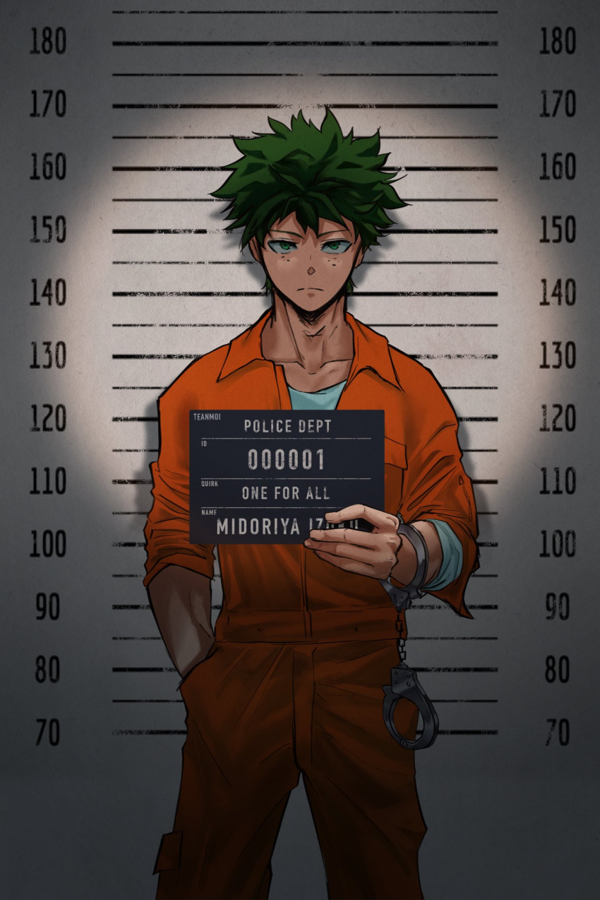 1boy boku_no_hero_academia character_name cuffs english_commentary english_text freckles green_hair hand_in_pocket handcuffs height_chart height_mark highres holding holding_sign lineup looking_at_viewer midoriya_izuku mugshot prison_clothes sign solo teanmoi