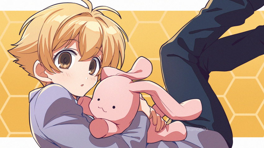 1boy antenna_hair asada_hachi bangs banned_artist black_pants blazer blonde_hair blush commentary eyebrows_visible_through_hair from_side haninozuka_mitsukuni highres holding holding_stuffed_toy honeycomb_(pattern) honeycomb_background jacket legs_up long_sleeves looking_at_viewer male_focus object_hug ouran_high_school_host_club ouran_high_school_uniform pants parted_lips purple_jacket school_uniform short_hair solo stuffed_animal stuffed_bunny stuffed_toy twitter_username watermark yellow_eyes