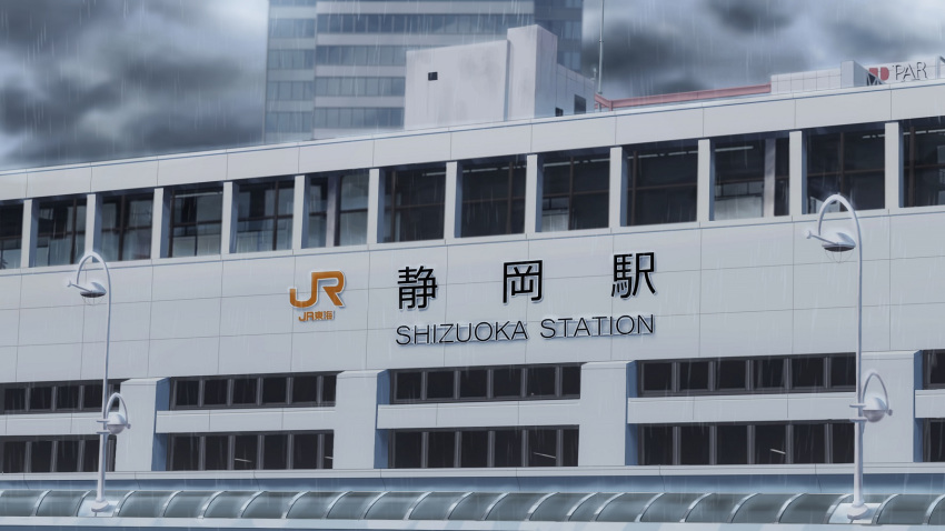 building city cityscape clouds cloudy_sky commentary_request grey_sky highres isbeyvan japan lamppost no_humans original outdoors rain scenery shizuoka_prefecture sky train_station window