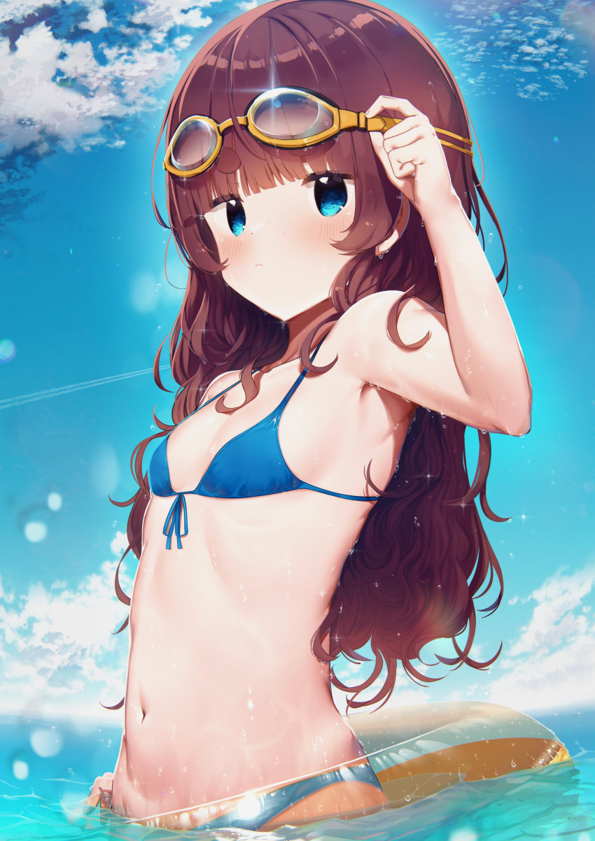 1girl :&lt; absurdres arm_up armpits bangs bikini blue_bikini blue_eyes blunt_bangs breasts brown_hair clouds eyebrows eyebrows_visible_through_hair goggles goggles_on_head highres innertube liely long_hair looking_at_viewer navel ocean original outdoors partially_submerged sky small_breasts solo swimsuit upper_body wading water wet