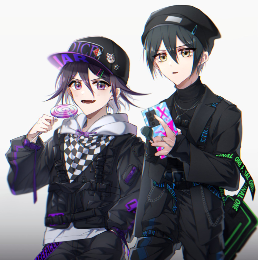 2boys alternate_costume bangs baseball_cap beanie black_hair black_headwear black_jacket black_pants black_sweater brown_eyes candy checkered_clothes checkered_scarf danganronpa_(series) danganronpa_v3:_killing_harmony food gradient gradient_background grey_background hair_between_eyes hair_ornament hairclip hat highres holding holding_candy holding_food holding_lollipop hood hood_down jacket jewelry lollipop long_sleeves looking_at_viewer lysm425 male_focus multiple_boys necklace open_mouth ouma_kokichi pants pink_eyes saihara_shuuichi scarf short_hair simple_background sweater