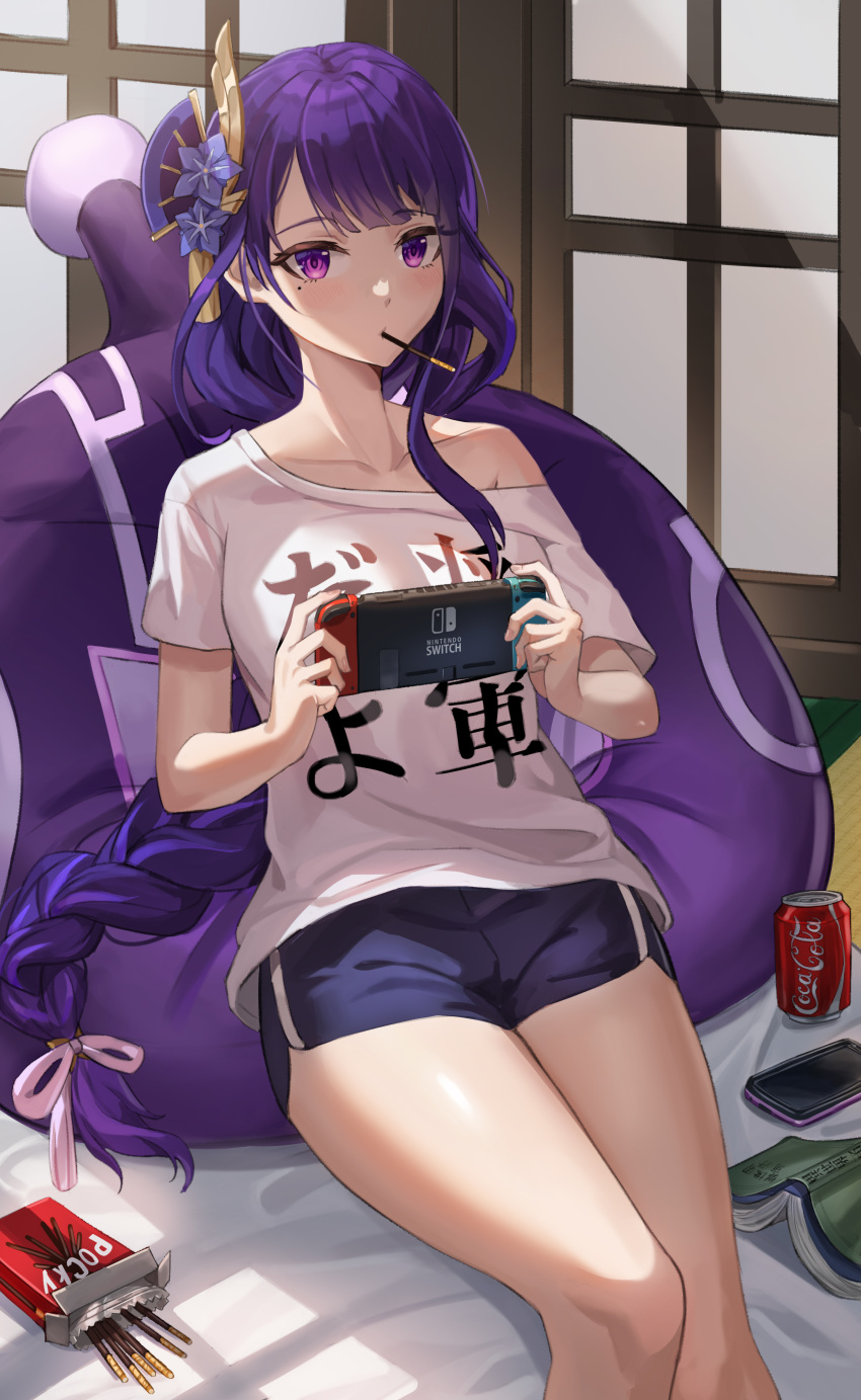 1girl absurdres alternate_costume bangs bean_bag_chair blush book braid braided_ponytail can casual cellphone clothes_writing coca-cola collarbone controller flower food game_controller genshin_impact hair_flower hair_ornament highres holding holding_controller holding_game_controller indoors looking_at_viewer mole mole_under_eye nintendo_switch on_floor phone pocky pocky_in_mouth print_shirt purple_hair raiden_shogun shirt short_shorts shorts single_bare_shoulder sitting skl slime_(genshin_impact) smartphone snack soda_can solo strap_slip t-shirt thighs translation_request violet_eyes