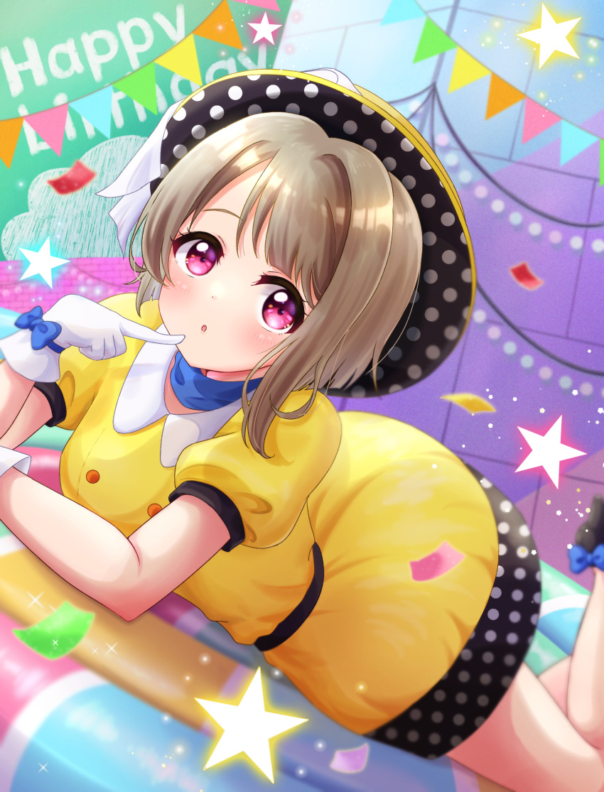1girl :o absurdres blurry brown_hair commentary depth_of_field dress dutch_angle eyebrows_behind_hair finger_to_mouth gloves happy_birthday hat highres light_brown_hair looking_at_viewer love_live! love_live!_nijigasaki_high_school_idol_club lying nakasu_kasumi on_stomach pink_eyes polka_dot poppin'_up_(love_live!) puffy_short_sleeves puffy_sleeves ritaso short_hair short_sleeves solo tareme white_gloves yellow_dress
