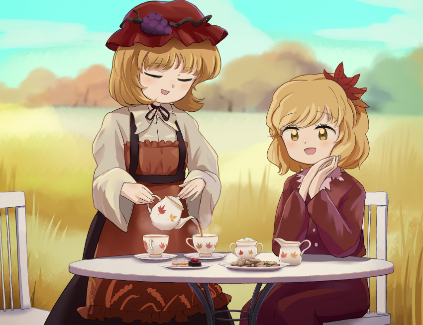 2girls aki_minoriko aki_shizuha apron autumn_leaves blonde_hair closed_eyes clouds commentary_request cup dress eyebrows_visible_through_hair food fruit fruit_hat_ornament grapes hair_ornament highres leaf leaf_hair_ornament leaf_on_head multiple_girls open_mouth red_headwear sky smile street_dog tea teapot touhou tree wheat yellow_eyes