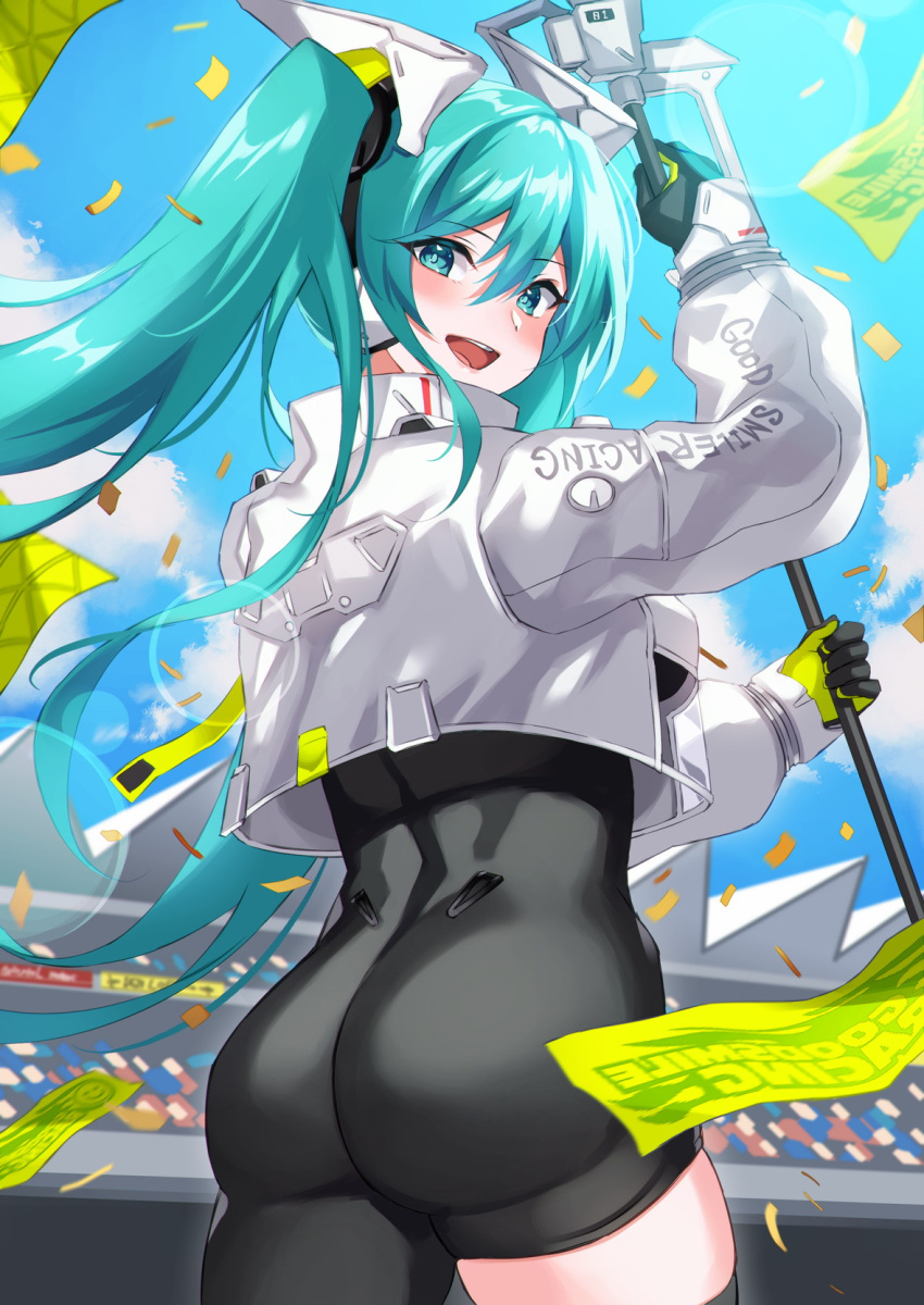 1girl :d aqua_eyes aqua_hair armor ass bangs black_bodysuit black_gloves blue_sky blush bodysuit breasts clothes_writing confetti cowboy_shot crop_top day eyebrows_visible_through_hair from_behind gloves green_gloves hair_between_eyes hatsune_miku highres holding inue_ao lens_flare long_hair long_sleeves looking_at_viewer looking_back medium_breasts open_mouth outdoors racing_miku racing_miku_(2022) see-through skin_tight sky smile solo stadium sunlight twintails two-tone_gloves very_long_hair vocaloid