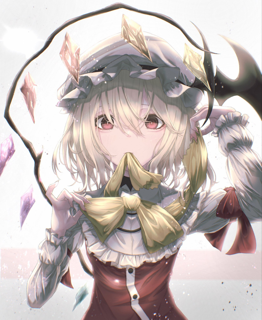 1girl blonde_hair bow bowtie collar crystal dress flandre_scarlet frilled_collar frilled_dress frills hat highres long_sleeves medium_hair mob_cap mouth_hold one_side_up red_dress red_eyes ribbon ribbon_in_mouth solo touhou tqg_07 white_background white_collar wings yellow_bow yellow_bowtie