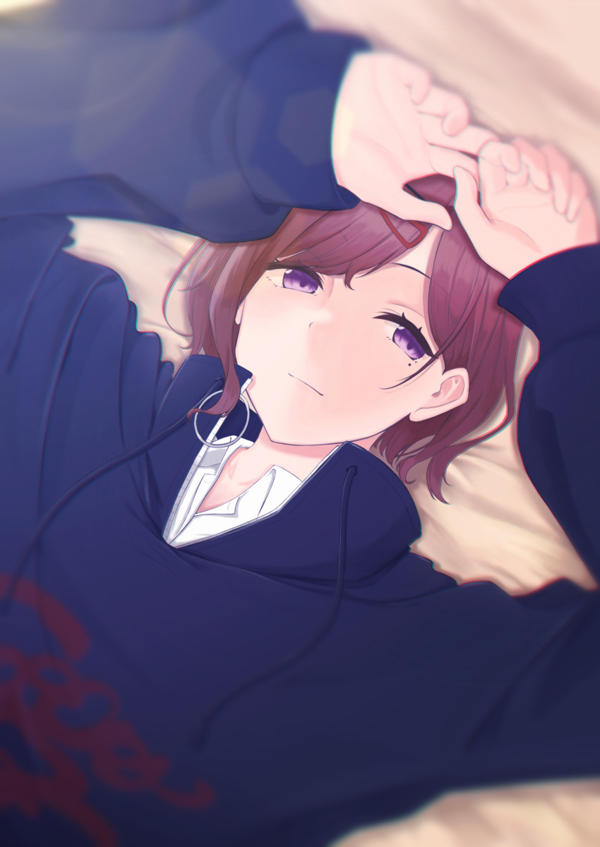 1girl :| absurdres arms_up bangs black_sweater blurry brown_hair closed_mouth depth_of_field highres higuchi_madoka idolmaster idolmaster_shiny_colors looking_at_viewer lying mole mole_under_eye on_stomach parted_bangs seseri_aoba short_hair solo sweater sweatshirt swept_bangs violet_eyes