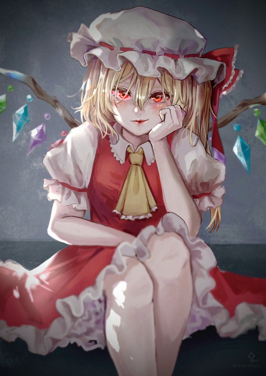 1girl ascot bangs blonde_hair closed_mouth collared_shirt commentary crystal feet_out_of_frame flandre_scarlet frilled_ascot frilled_shirt_collar frilled_skirt frilled_sleeves frills glowing glowing_eyes grey_background hair_between_eyes hand_on_own_cheek hand_on_own_face happy hat hat_ribbon highres hoshiringo0902 legs lips looking_at_viewer medium_hair mob_cap puffy_short_sleeves puffy_sleeves red_eyes red_lips red_ribbon red_skirt red_vest ribbon ribbon-trimmed_headwear ribbon_trim shirt short_sleeves side_ponytail sitting skirt smile solo touhou vest white_headwear white_shirt wings yellow_ascot