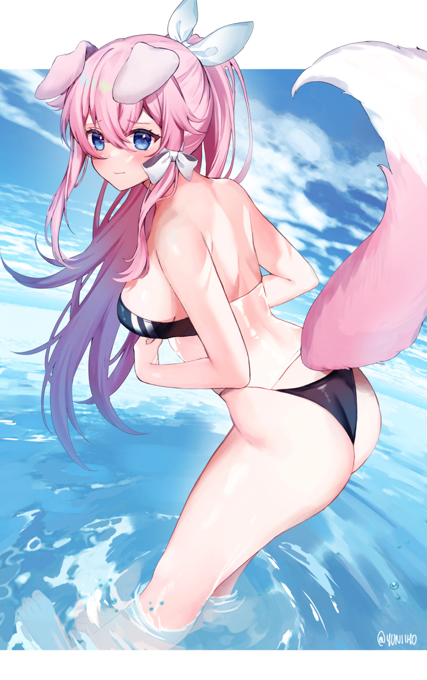 1girl animal_ears ass bangs blue_eyes blush breasts closed_mouth clouds day dog_ears dog_girl dog_tail eyebrows_visible_through_hair from_side gris_swimsuit hair_between_eyes hair_ribbon highres leaning_forward long_hair looking_to_the_side medium_breasts meme_attire ocean one_eye_closed outdoors pink_hair ponytail ribbon see-through solo tail very_long_hair virtual_youtuber vyugen wading water white_ribbon yuniiho yuniiho_(vtuber)