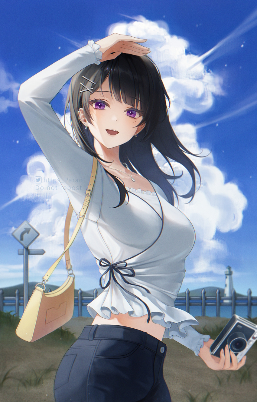 1girl :d arm_up bag bangs black_hair black_pants black_ribbon blue_sky blunt_bangs blush breasts camera clouds cowboy_shot day earrings eyebrows_visible_through_hair fence frilled_sleeves frills hair_ornament highres holding holding_camera jewelry large_breasts lighthouse long_hair long_sleeves looking_at_viewer midriff_peek mole mole_under_eye necklace open_mouth original outdoors pants paran ribbon road_sign shirt shoulder_bag sign sky smile symbol_in_eye violet_eyes white_shirt x_hair_ornament