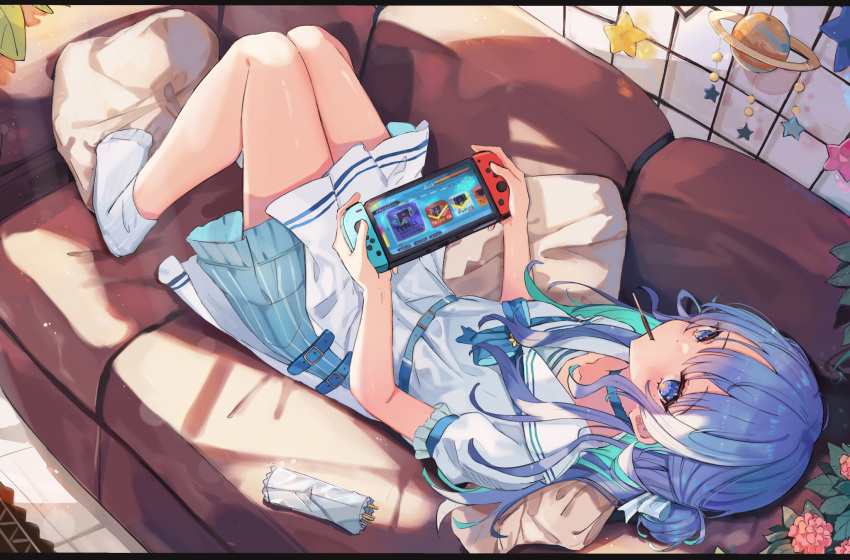 1girl aqua_hair bangs belt belt_buckle blue_eyes blue_hair blue_ribbon blush buckle collarbone colored_inner_hair couch dress eyebrows_visible_through_hair food food_in_mouth frilled_dress frills highres holding hololive hoshimachi_suisei indoors knees_up lying miakiuehashi mobile mouth_hold multicolored_hair nintendo_switch on_back on_couch pillow pocky ribbon sailor_collar sailor_dress short_sleeves side_bun socks solo two-tone_hair virtual_youtuber white_dress white_legwear white_sailor_collar