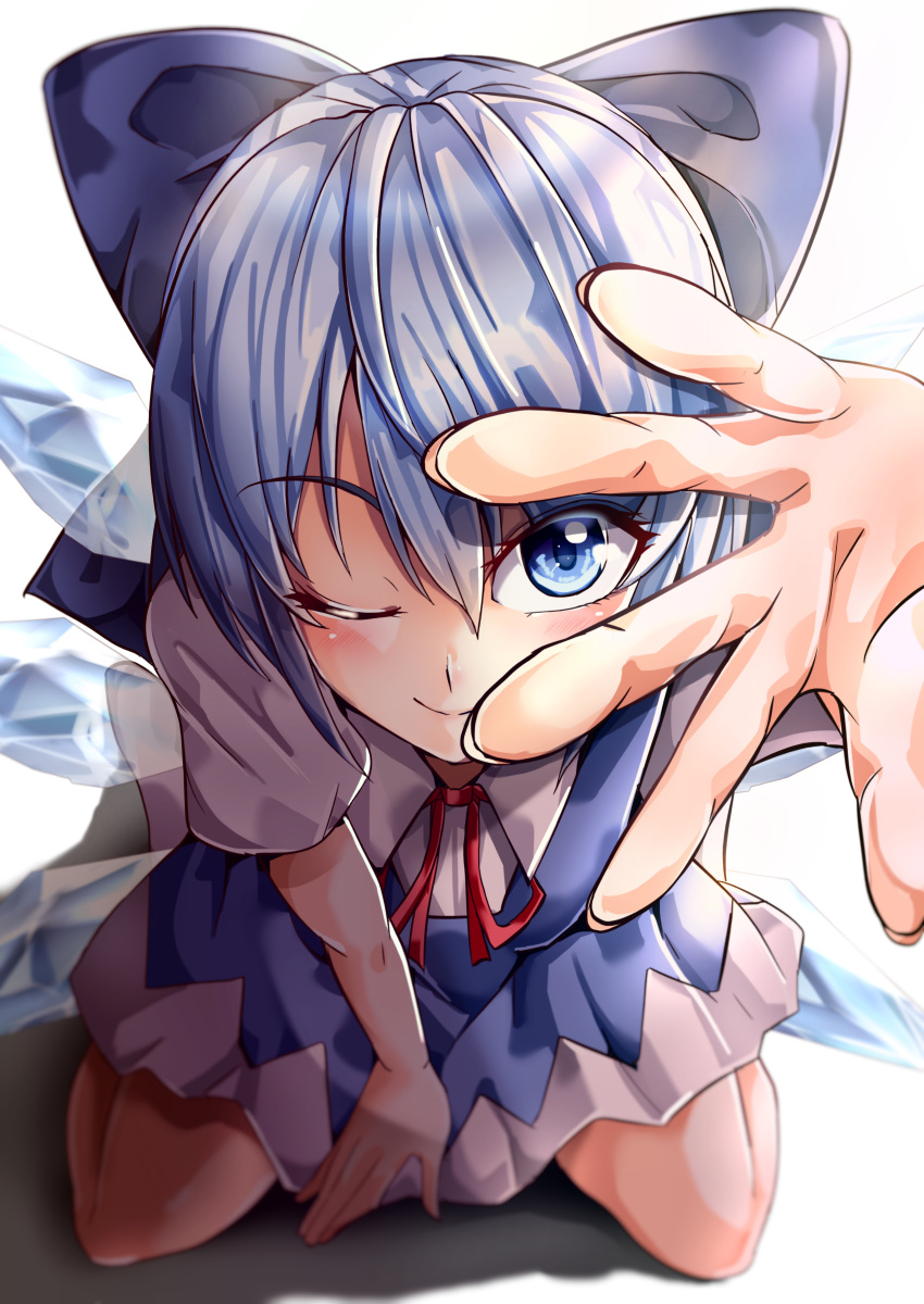 1girl absurdres between_legs blue_bow blue_dress blue_eyes blue_hair bow cirno collared_shirt commentary_request detached_wings dress eyebrows_visible_through_hair foreshortening hair_bow hand_between_legs highres ice ice_wings leaning_forward looking_at_viewer maboroshi_mochi neck_ribbon one_eye_closed pinafore_dress red_ribbon ribbon shiny shiny_hair shirt short_hair simple_background solo touhou white_background white_shirt wings