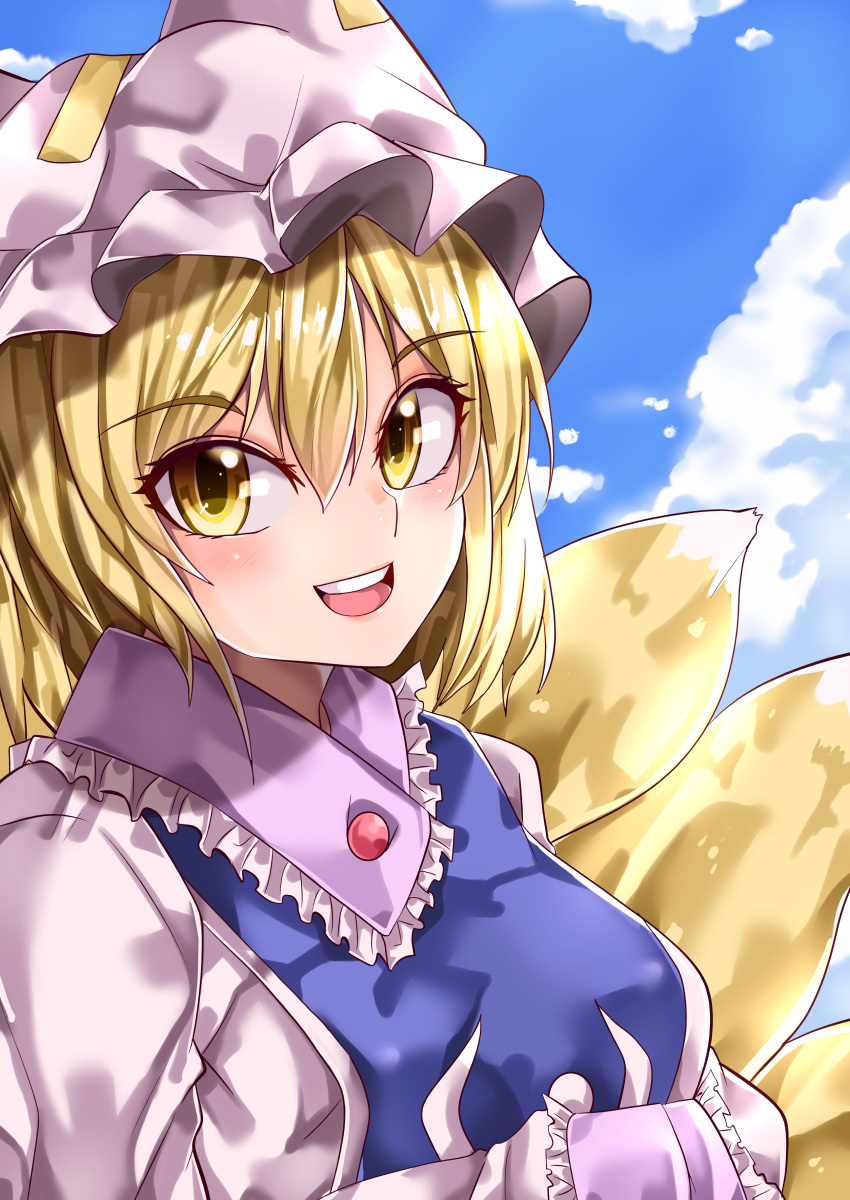 1girl absurdres blonde_hair blue_sky blue_tabard clouds cloudy_sky commentary_request eyebrows_visible_through_hair fox_tail frilled_shirt_collar frilled_sleeves frills hair_between_eyes hat highres long_sleeves looking_at_viewer maboroshi_mochi medium_hair multiple_tails open_mouth outdoors pillow_hat shiny shiny_hair sky solo tail teeth touhou upper_body upper_teeth white_headwear yakumo_ran yellow_eyes yellow_tail