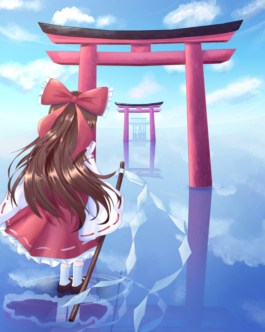 1girl absurdres bare_shoulders bow brown_footwear brown_hair clouds frilled_bow frills from_behind gohei hair_bow hakurei_reimu highres japanese_clothes long_hair miko red_shirt red_skirt reflection ribbon-trimmed_sleeves ribbon_trim scenery shirt skirt smallsword38 socks solo standing standing_on_liquid torii touhou