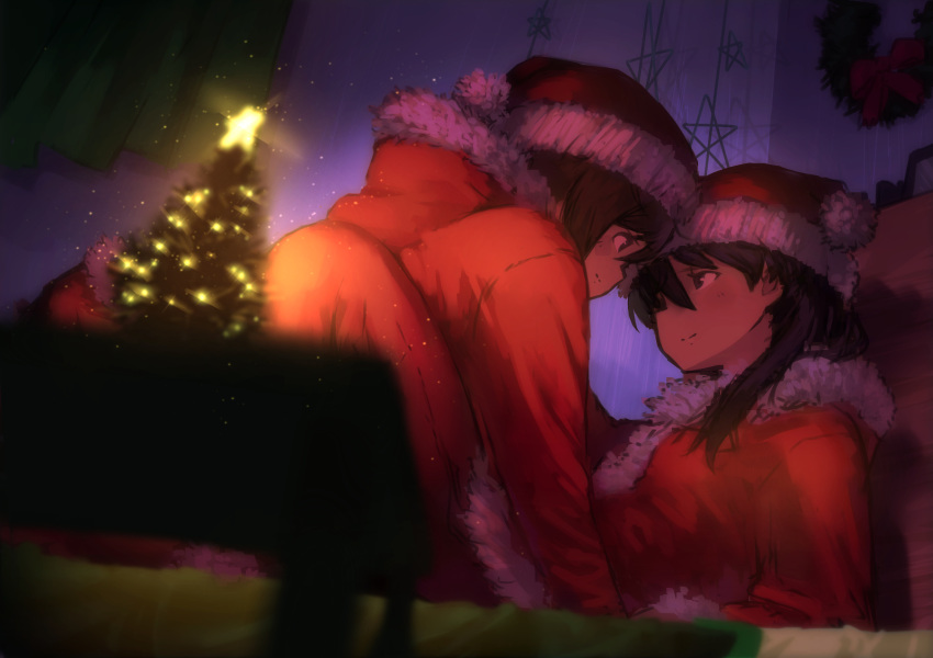 2girls black_hair blurry brown_hair christmas christmas_ornaments depth_of_field eye_contact from_below hair_between_eyes highres light_smile looking_at_another lying medium_hair multiple_girls natsuno_kanasemi on_back original santa_costume short_hair straddling wreath yuri