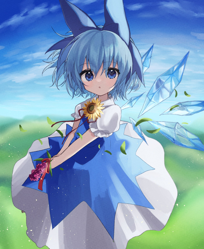 1girl :o blue_bow blue_dress blue_eyes blue_hair blue_sky bow cirno clouds day dress flower hair_bow highres holding ice ice_wings looking_at_viewer omoitukanee outdoors puffy_short_sleeves puffy_sleeves short_hair short_sleeves sky solo sunflower touhou wings