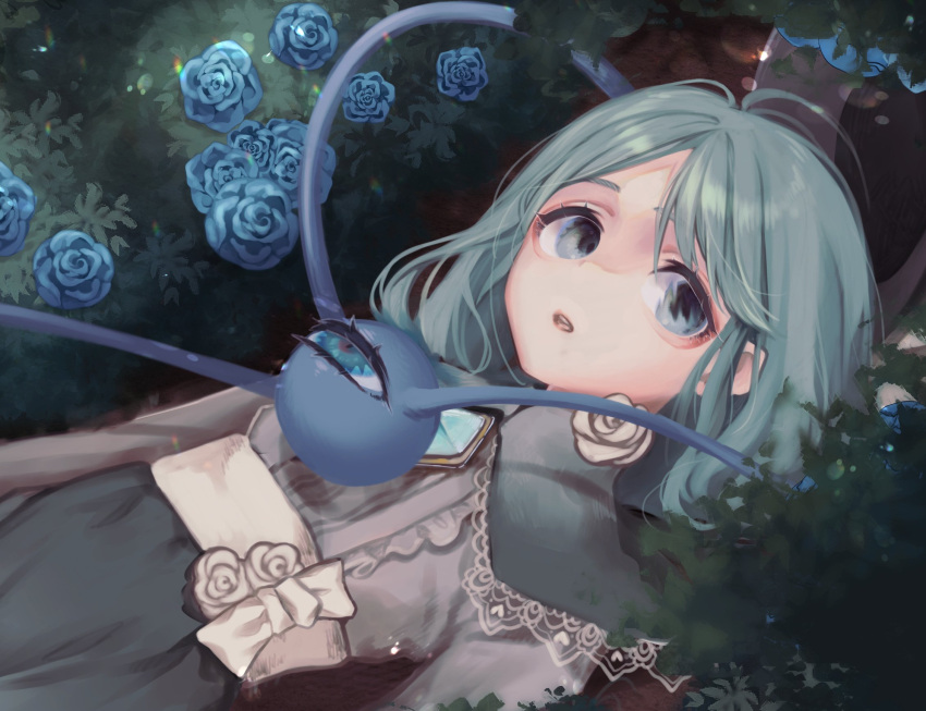 1girl arms_at_sides bangs blue_eyes blue_flower blue_rose bow brooch bush capelet commentary eyebrows_behind_hair flower green_capelet green_hair green_skirt highres jewelry komeiji_koishi lace lace-trimmed_capelet lace_trim looking_at_viewer lying medium_hair mokokiyo_(asaddr) no_hat no_headwear on_back parted_bangs parted_lips rose shirt skirt solo teeth third_eye touhou upper_body upper_teeth waist_bow white_bow white_flower white_rose white_shirt
