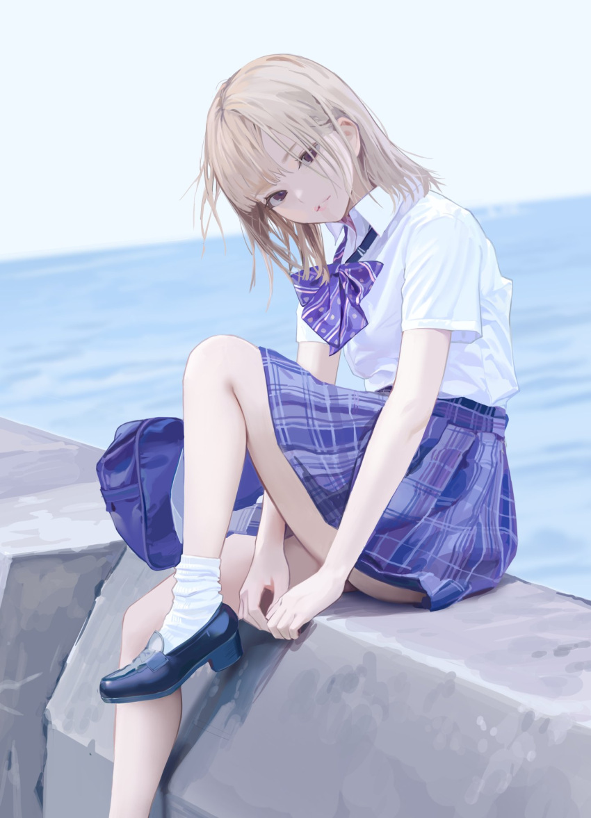 1girl :d bangs banned_artist blonde_hair blue_skirt blue_sky bow bowtie brown_eyes grin highres icomochi looking_at_viewer medium_hair original outdoors purple_bow purple_bowtie school_uniform shirt short_sleeves sitting skirt sky smile solo teeth water white_legwear white_shirt