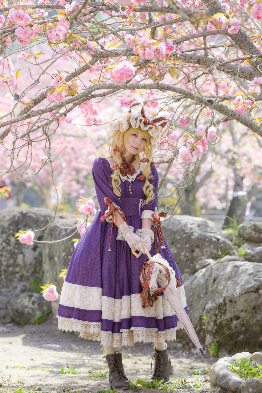 1girl blonde_hair blurry breasts brown_footwear buttons closed_mouth closed_umbrella cosplay cosplay_photo depth_of_field dress flower full_body gloves head_tilt highres holding holding_umbrella looking_at_another medium_hair outdoors photo_(medium) pigeon-toed purple_dress purple_flower shoes small_breasts smile solo standing touhou umbrella white_gloves white_umbrella xalice_dollsx yakumo_yukari yakumo_yukari_(cosplay)