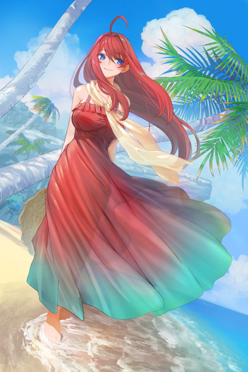 1girl ahoge arms_behind_back bangs bare_shoulders barefoot beach blue_eyes blue_sky blush breasts closed_mouth clouds collarbone commentary_request day dress dutch_angle eyebrows_visible_through_hair floating_hair full_body go-toubun_no_hanayome gradient_dress green_dress highres hirokiku large_breasts long_hair looking_at_viewer nakano_itsuki ocean outdoors palm_tree red_dress redhead see-through sky smile soaking_feet solo tree very_long_hair water wind