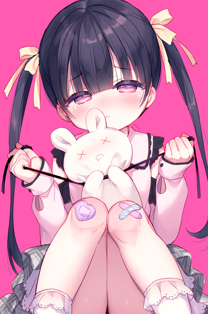 1girl bandaid bandaid_on_knee bandaid_on_leg bangs black_hair blush bow closed_mouth collared_shirt commentary_request crossed_bandaids eyebrows_visible_through_hair feet_out_of_frame frilled_legwear grey_skirt hair_bow half-closed_eyes head_tilt highres holding knees_together_feet_apart knees_up long_hair long_sleeves nose_blush original pink_background plaid plaid_skirt puffy_long_sleeves puffy_sleeves shirt simple_background sitting skirt sleeves_past_wrists socks solo strangling stuffed_animal stuffed_bunny stuffed_toy tears twintails usashiro_mani very_long_hair violet_eyes white_legwear white_shirt yellow_bow