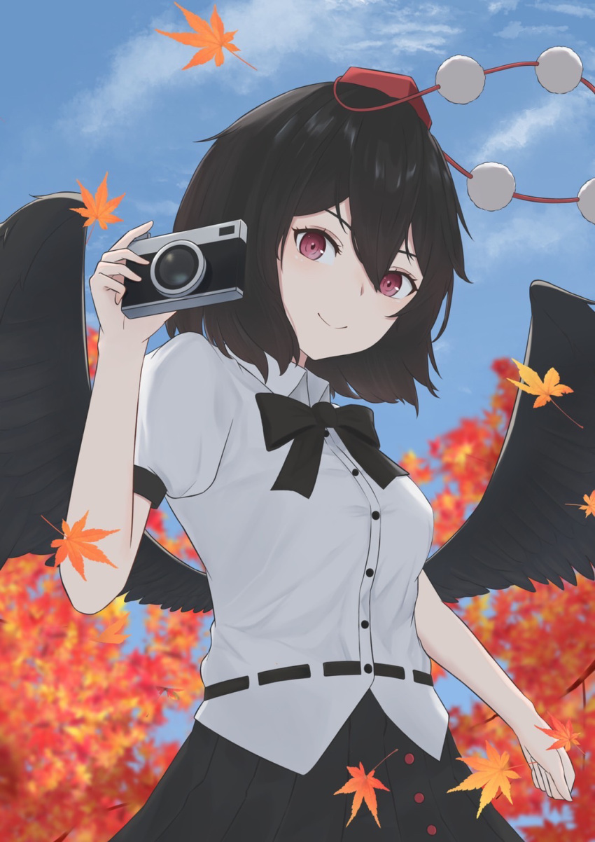 1girl ato_0_0 autumn_leaves bird_wings black_bow black_bowtie black_hair black_skirt black_wings bow bowtie breasts camera closed_mouth collared_shirt commentary_request feathered_wings happy hat highres holding holding_camera leaf pom_pom_(clothes) puffy_short_sleeves puffy_sleeves red_eyes red_headwear shameimaru_aya shirt short_hair short_sleeves skirt small_breasts smile tengu tokin_hat touhou white_shirt wings