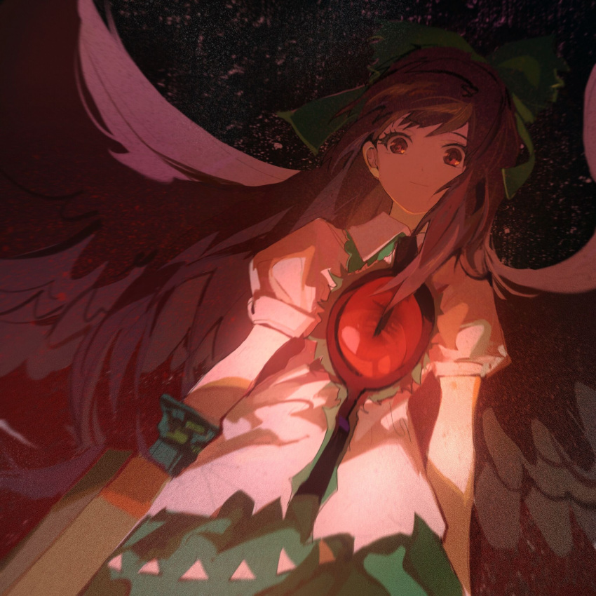 1girl arm_cannon arms_at_sides bird_wings black_wings blurry bow brown_eyes brown_hair closed_mouth collared_shirt commentary feathered_wings frilled_shirt_collar frills glowing green_bow green_skirt hair_bow hako_(misheyes) highres light_smile long_hair looking_at_viewer puffy_short_sleeves puffy_sleeves red_eyes reiuji_utsuho shirt short_sleeves skirt solo third_eye touhou upper_body very_long_hair weapon white_shirt wings