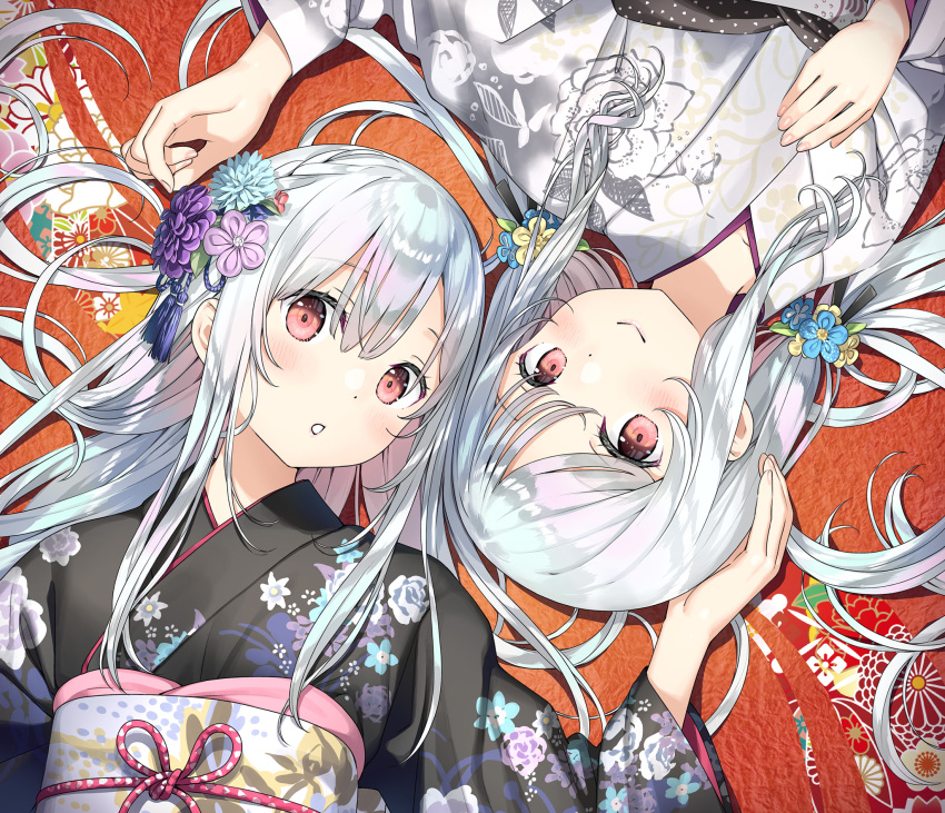 2girls :o bangs black_kimono blue_flower blush closed_mouth eyebrows_visible_through_hair floral_print flower from_above hair_flower hair_ornament hand_on_another's_head hand_on_own_chest head_tilt highres japanese_clothes kantoku kimono long_hair long_sleeves looking_at_viewer lying multiple_girls obi on_back original parted_lips pink_flower print_kimono purple_flower red_eyes sash smile upper_body white_hair white_kimono wide_sleeves yellow_flower