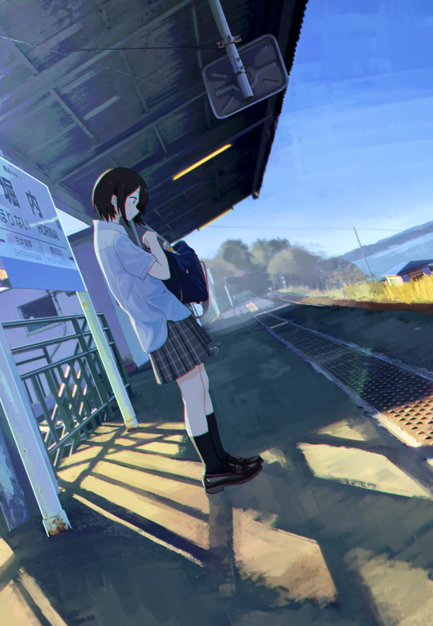 1girl absurdres bag black_footwear black_hair black_legwear black_skirt blue_sky collared_shirt commentary highres holding holding_bag horizon house morning ocean original outdoors pleated_skirt power_lines sakeharasu school_bag school_uniform shirt short_hair short_sleeves sign skirt sky smile socks solo standing train_station train_station_platform untucked_shirt vanishing_point white_shirt