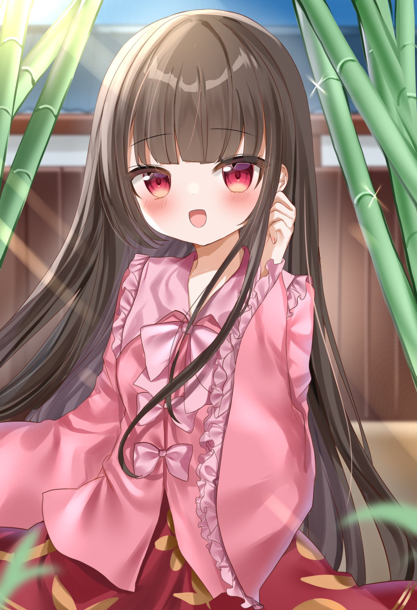 1girl bamboo bamboo_forest bamboo_print bangs blouse blurry blush bow bowtie breasts brown_hair collarbone collared_shirt commentary_request eientei eyebrows_visible_through_hair fence forest frills hand_up highres houraisan_kaguya house leaf leaf_print long_hair long_sleeves medium_breasts nature okome2028 open_mouth pink_bow pink_bowtie pink_shirt red_eyes red_skirt shirt skirt smile solo sparkle sunlight tongue touhou wall wide_sleeves