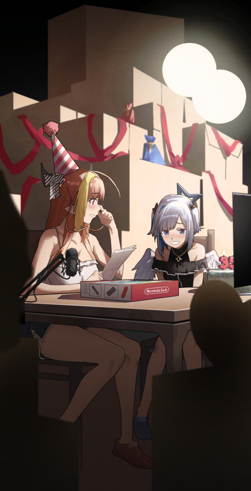 2girls absurdres amane_kanata birthday_party blue_eyes bow box cake candle food gift hat highres holding holding_paper hololive horns kiryu_coco microphone microphone_stand multiple_girls nintendo_switch orange_hair paper party_hat red_eyes red_ribbon ribbon shorts sitting smile table tearing_up tears white_hair wings wiping_tears xiaoju_xiaojie