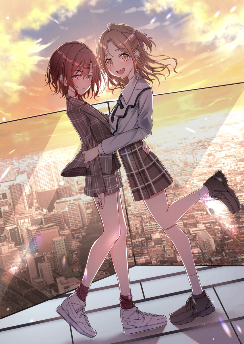 2girls absurdres blush brown_hair city cityscape dutch_angle full_body highres higuchi_madoka ichikawa_hinana idolmaster idolmaster_shiny_colors jacket light_brown_hair looking_at_viewer looking_to_the_side multiple_girls one_side_up plaid plaid_jacket plaid_skirt rooftop shoes skirt smile sneakers standing standing_on_one_leg sunset yuri yzk_knmn