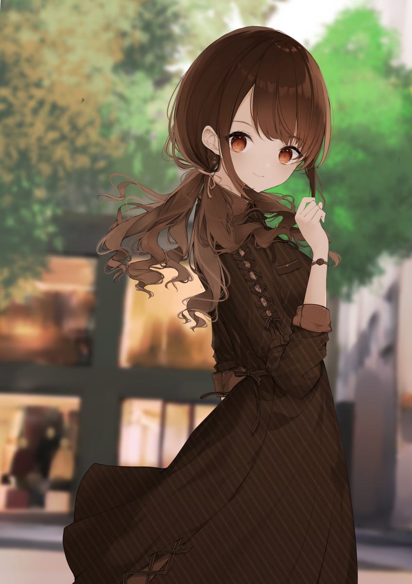 1girl absurdres blurry blurry_background breasts brown_dress brown_eyes brown_hair building closed_mouth commentary_request day depth_of_field dress from_side hand_up highres long_hair long_sleeves looking_at_viewer looking_to_the_side low_twintails original outdoors small_breasts smile solo tree twintails uzuki_tsukuyo watch watch window