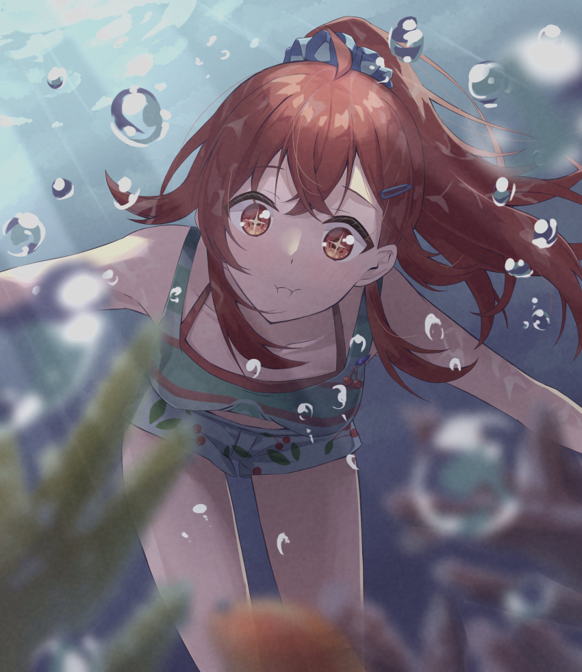 1girl absurdres ahoge air_bubble bangs blue_scrunchie blurry blurry_foreground breasts bubble cherry_print collarbone commentary coral eel fish food_print green_tank_top hair_between_eyes hair_ornament hairclip highres holding_breath idolmaster idolmaster_shiny_colors komiya_kaho legs long_hair looking_ahead medium_breasts outstretched_arms ponytail puffy_cheeks red_eyes red_swimsuit scrunchie shirt short_shorts shorts sidelocks solo sparkling_eyes striped striped_shirt sunlight swimsuit swimsuit_under_clothes tank_top thighs toretate_saburou underwater white_shorts
