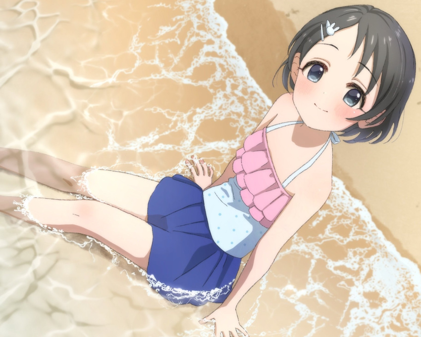 1girl arm_support bangs beach black_eyes black_hair blue_skirt blue_swimsuit blush bunny_hair_ornament child commentary_request day dot_nose flat_chest frills from_above hair_ornament hairclip highres idolmaster idolmaster_cinderella_girls legs looking_at_viewer looking_up megabee_e on_floor outdoors partially_submerged polka_dot polka_dot_swimsuit sasaki_chie short_hair sitting skirt smile solo swimsuit swimsuit_skirt thighs water